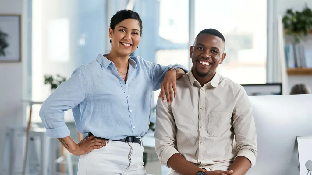 Woman and man posing for careers photo